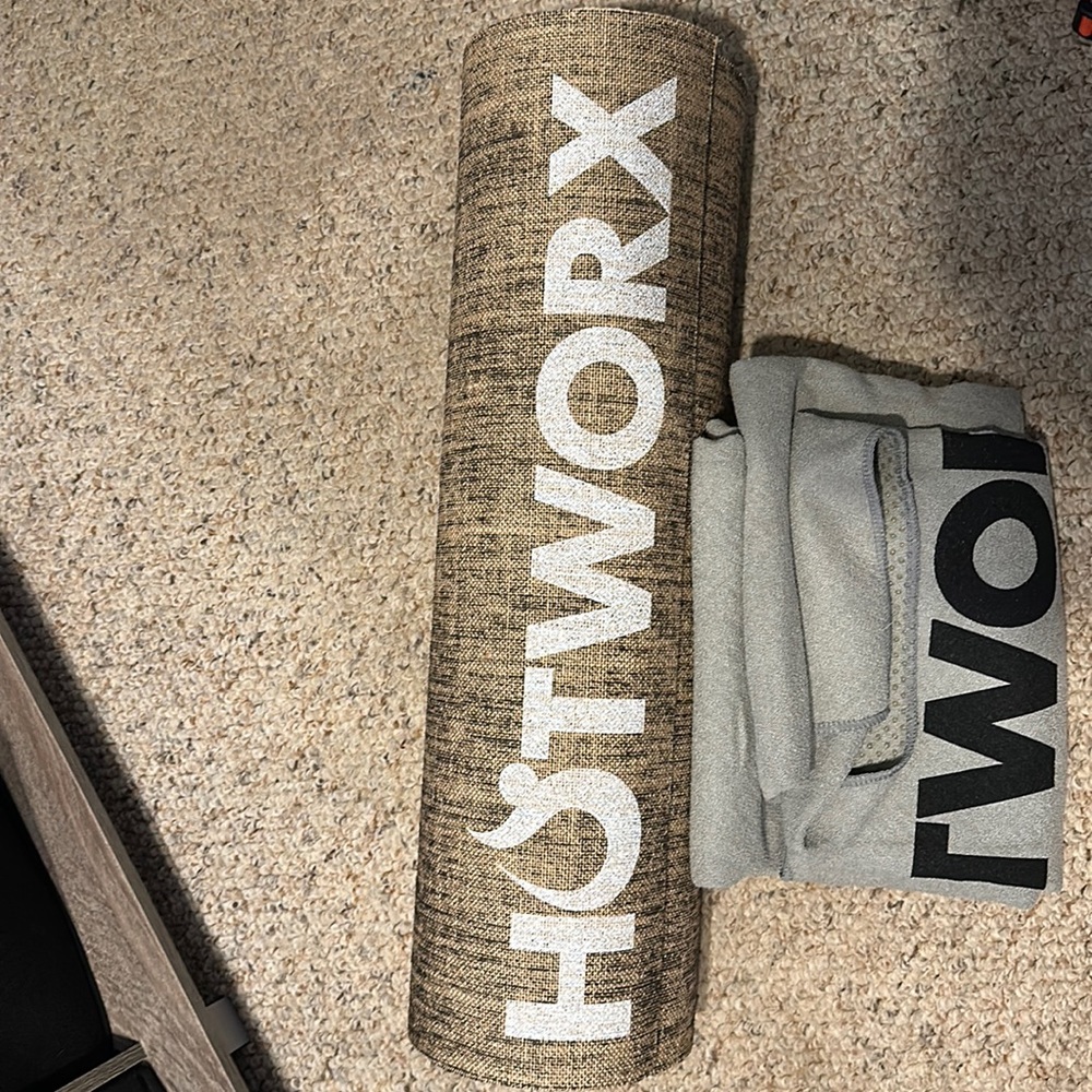 Hotworx brand yoga mat and Hotworx brand towel with grips on the back.